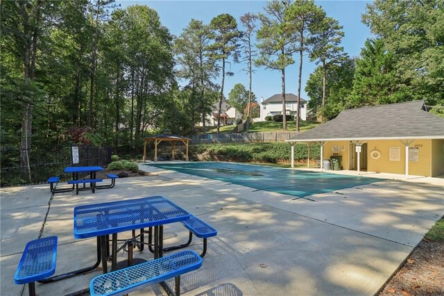 view of swimming pool featuring a patio