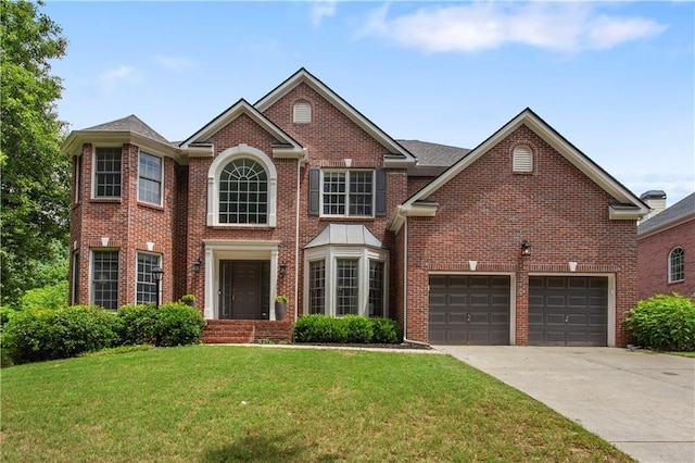 141 Ennisbrook Dr SE, Smyrna, GA 30082 - view of front of home with brick siding, a front yard, and driveway