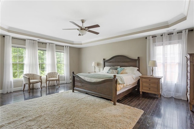 141 Ennisbrook Dr SE, Smyrna, GA 30082 - bedroom featuring a tray ceiling, crown molding, dark wood-style flooring, and baseboards