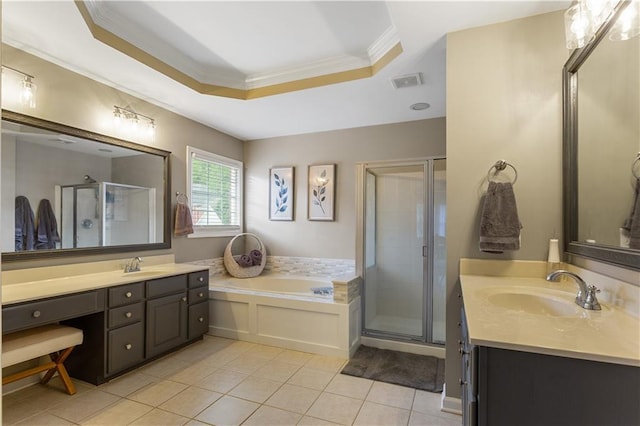 141 Ennisbrook Dr SE, Smyrna, GA 30082 - full bath with a tray ceiling, tile patterned floors, a shower stall, two vanities, and a garden tub