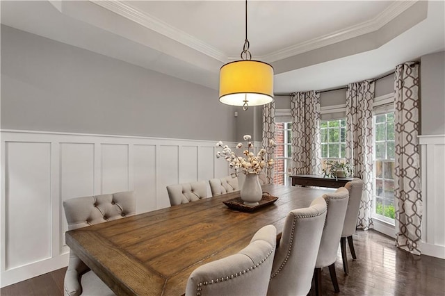 141 Ennisbrook Dr SE, Smyrna, GA 30082 - dining room with a decorative wall, dark wood-style floors, crown molding, a tray ceiling, and wainscoting