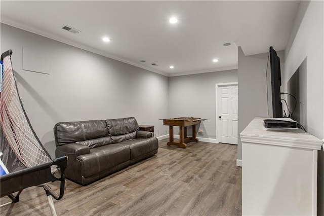 141 Ennisbrook Dr SE, Smyrna, GA 30082 - living room with recessed lighting, light wood-style flooring, baseboards, and crown molding