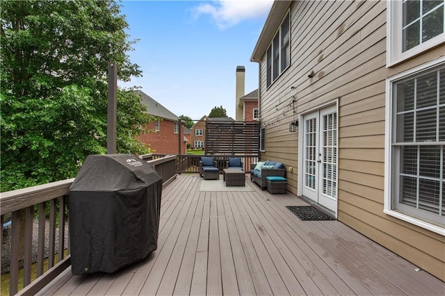 141 Ennisbrook Dr SE, Smyrna, GA 30082 - wooden terrace with french doors, outdoor lounge area, and grilling area