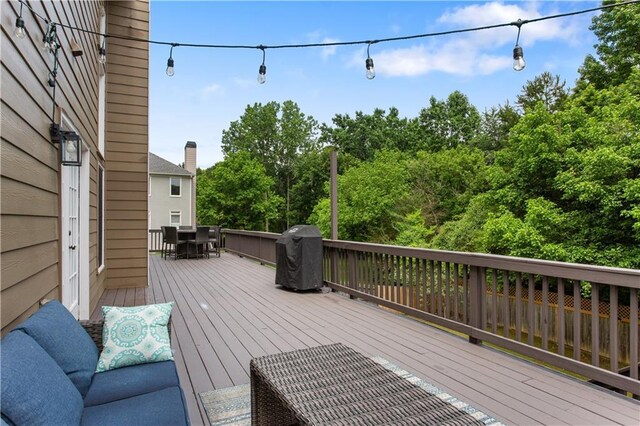 141 Ennisbrook Dr SE, Smyrna, GA 30082 - wooden deck featuring outdoor dining space and area for grilling