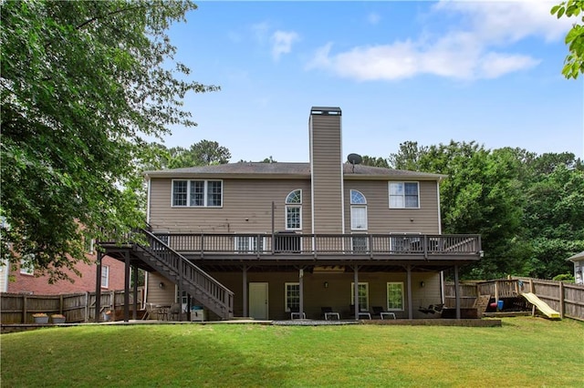 141 Ennisbrook Dr SE, Smyrna, GA 30082 - rear view of property with stairs, a wooden deck, a chimney, and a playground