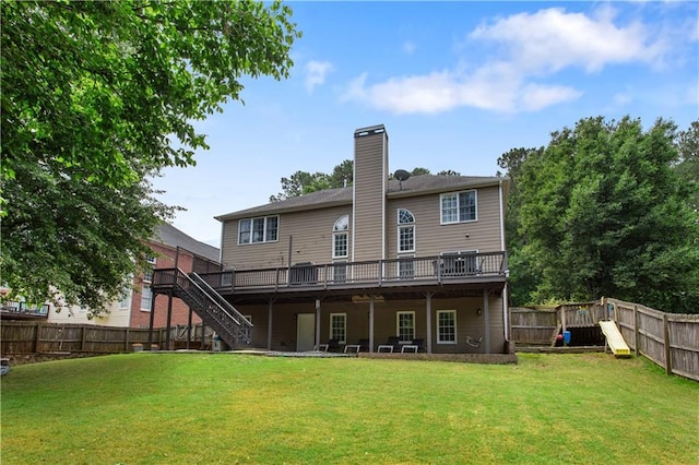 141 Ennisbrook Dr SE, Smyrna, GA 30082 - rear view of house with stairway, a wooden deck, a chimney, and a playground