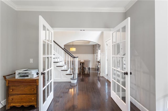 141 Ennisbrook Dr SE, Smyrna, GA 30082 - entrance foyer with french doors, arched walkways, hardwood / wood-style flooring, stairway, and ornamental molding