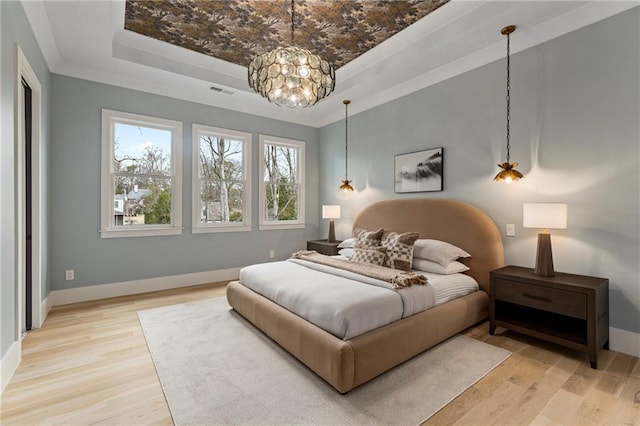 662 Timm Valley Rd NE, Atlanta, GA 30305 - bedroom with a tray ceiling, ornamental molding, baseboards, light wood-style floors, and visible vents