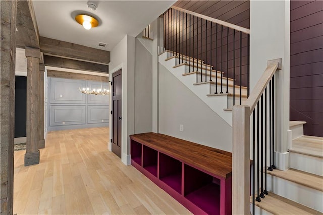 interior space with wood finished floors and visible vents