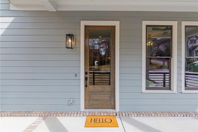 view of exterior entry with a porch