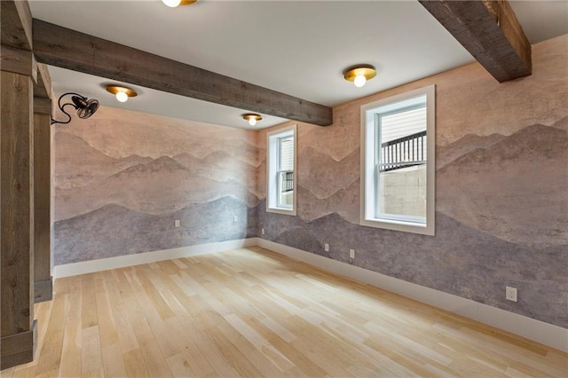 662 Timm Valley Rd NE, Atlanta, GA 30305 - empty room with baseboards, beamed ceiling, and wood finished floors