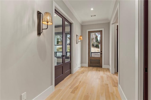 662 Timm Valley Rd NE, Atlanta, GA 30305 - entrance foyer with crown molding, light wood finished floors, baseboards, visible vents, and recessed lighting