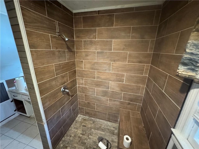 bathroom featuring a tile shower and tile patterned floors