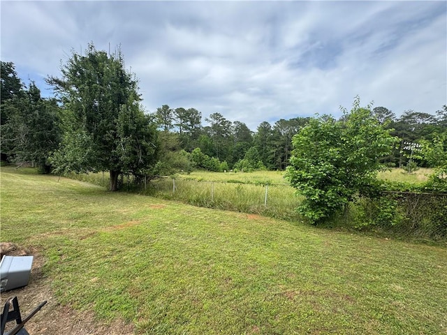 view of yard featuring a view of trees