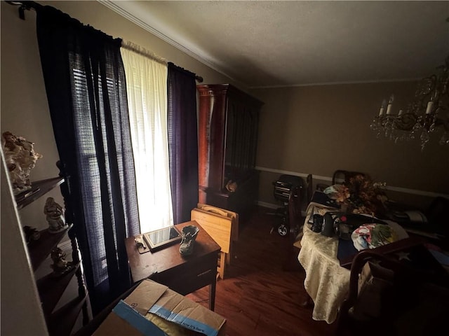 dining room with crown molding and wood finished floors