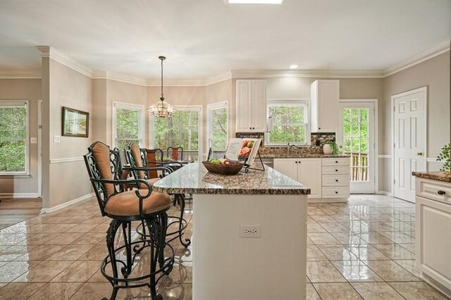 3130 Crestmont Way NW, Kennesaw, GA 30152 - kitchen with baseboards, stone counters, light tile patterned floors, white cabinets, and ornamental molding
