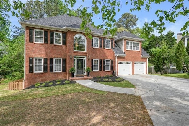 3130 Crestmont Way NW, Kennesaw, GA 30152 - colonial-style house featuring driveway, brick siding, and an attached garage
