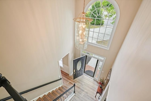 3130 Crestmont Way NW, Kennesaw, GA 30152 - foyer entrance featuring a chandelier, light wood-style floors, and a towering ceiling
