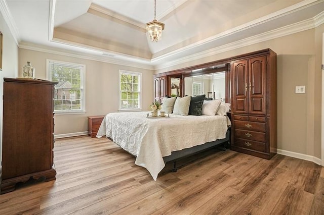 3130 Crestmont Way NW, Kennesaw, GA 30152 - bedroom featuring a tray ceiling, a chandelier, ornamental molding, light wood-type flooring, and baseboards