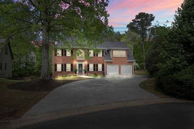 3130 Crestmont Way NW, Kennesaw, GA 30152 - colonial-style house featuring concrete driveway, brick siding, and an attached garage