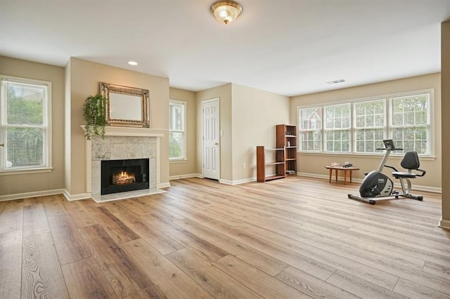 3130 Crestmont Way NW, Kennesaw, GA 30152 - exercise room with hardwood / wood-style flooring, baseboards, a tiled fireplace, and recessed lighting