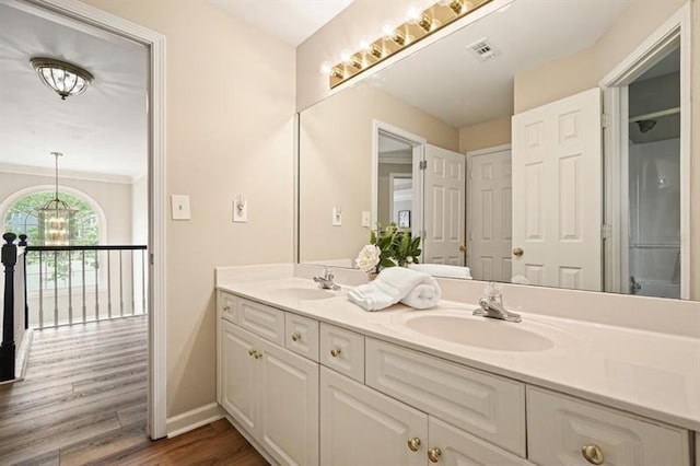 3130 Crestmont Way NW, Kennesaw, GA 30152 - bathroom with double vanity, wood finished floors, and baseboards