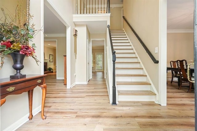 3130 Crestmont Way NW, Kennesaw, GA 30152 - stairway with crown molding, wood finished floors, and baseboards
