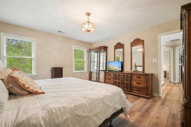 3130 Crestmont Way NW, Kennesaw, GA 30152 - bedroom with light wood-type flooring, multiple windows, a chandelier, and baseboards