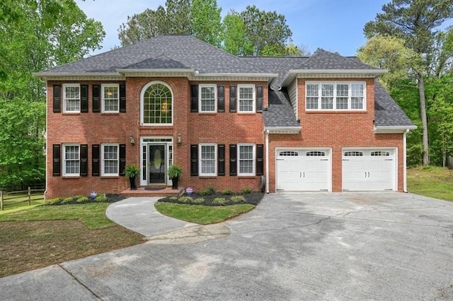 3130 Crestmont Way NW, Kennesaw, GA 30152 - colonial home with driveway, brick siding, an attached garage, and roof with shingles