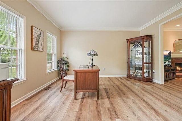 3130 Crestmont Way NW, Kennesaw, GA 30152 - office space featuring light wood-style floors, ornamental molding, a warm lit fireplace, and baseboards
