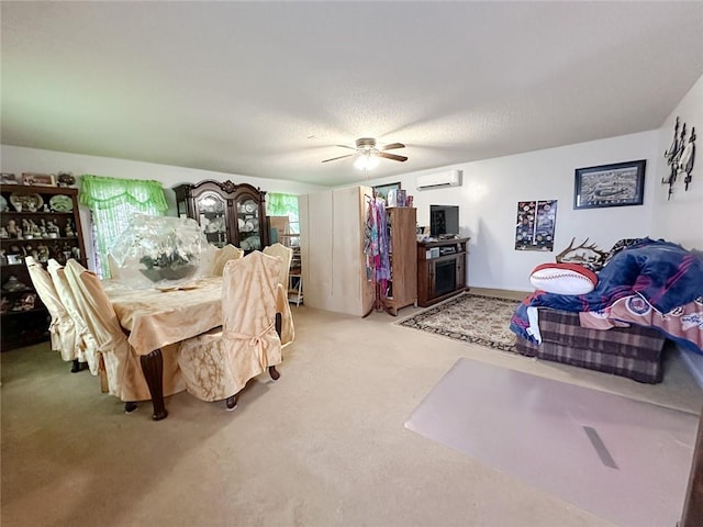 dining area with ceiling fan, a wall unit AC, and light colored carpet