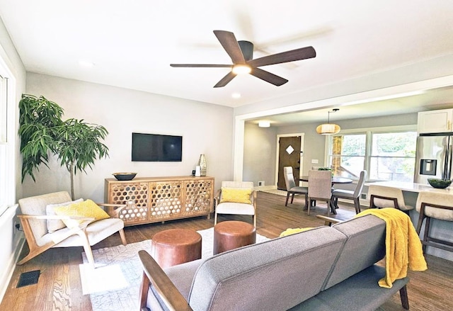 living area featuring a ceiling fan, dark wood finished floors, and recessed lighting