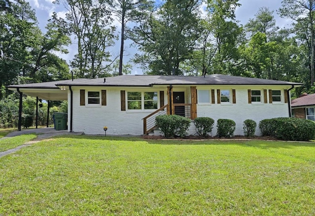 single story home with a front lawn, a carport, aphalt driveway, and brick siding