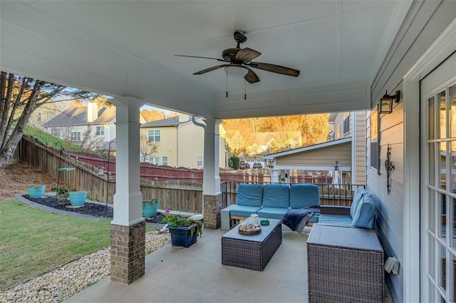 view of patio with ceiling fan and an outdoor living space