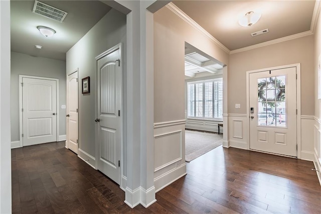 entryway with dark wood-style floors, coffered ceiling, and visible vents