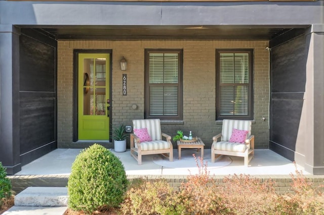 view of exterior entry featuring a porch