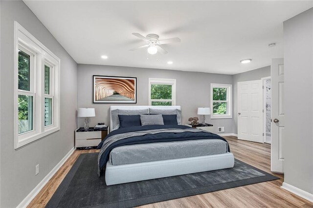 bedroom with hardwood / wood-style floors and ceiling fan