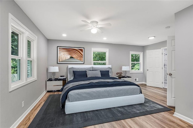 bedroom with ceiling fan, recessed lighting, wood finished floors, and baseboards