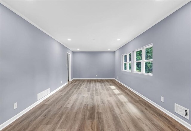 spare room featuring light hardwood / wood-style flooring