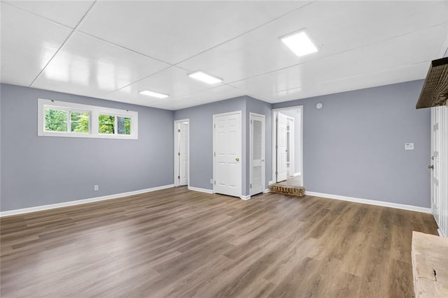 empty room with wood finished floors and baseboards