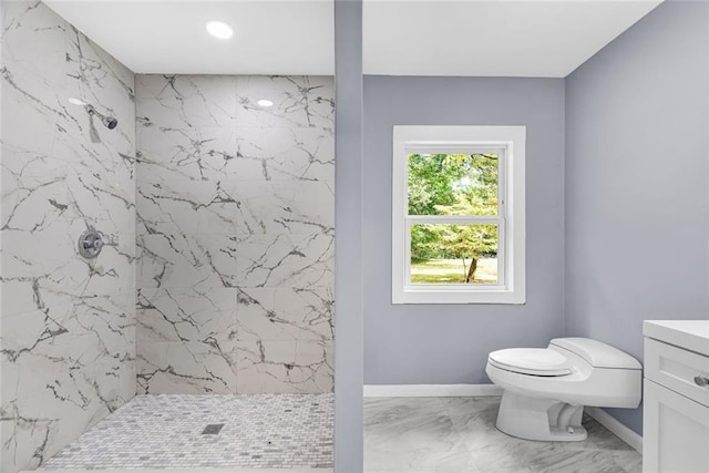 bathroom with marble finish floor, baseboards, toilet, and a marble finish shower