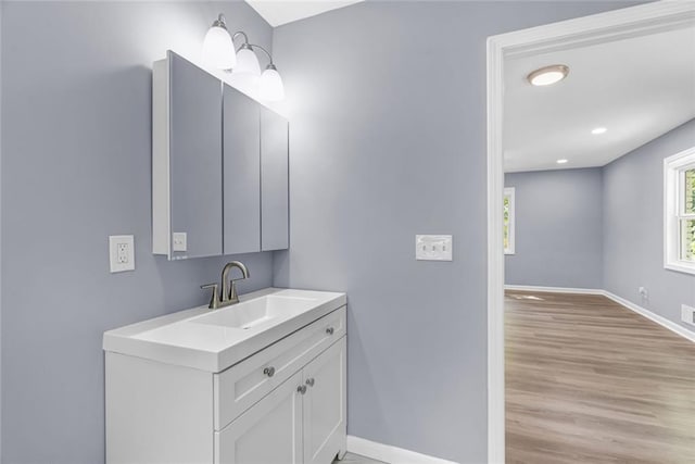 bathroom with vanity and wood-type flooring