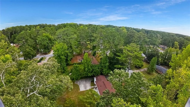 birds eye view of property with a wooded view