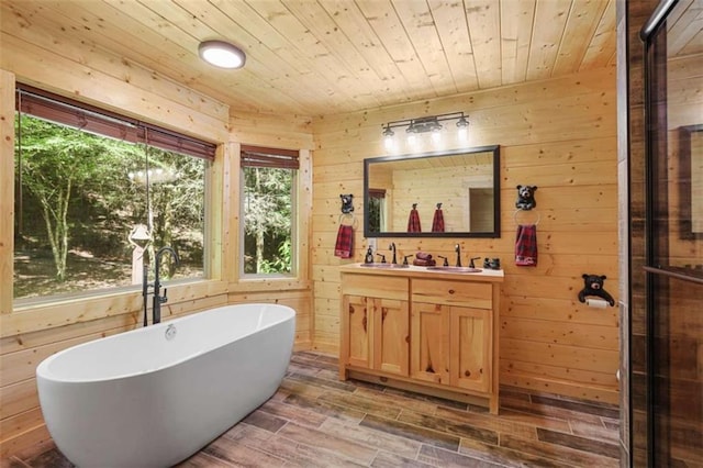 1102 Soque Wilderness Rd, Clarkesville, GA 30523 - full bath featuring double vanity, a freestanding tub, wooden walls, wooden ceiling, and wood finished floors
