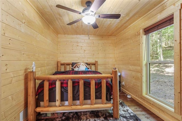 1102 Soque Wilderness Rd, Clarkesville, GA 30523 - bedroom with wood ceiling, wooden walls, wood-type flooring, and a ceiling fan