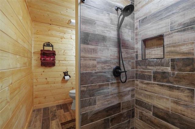1102 Soque Wilderness Rd, Clarkesville, GA 30523 - full bathroom featuring wooden walls, tiled shower, wood finished floors, and toilet