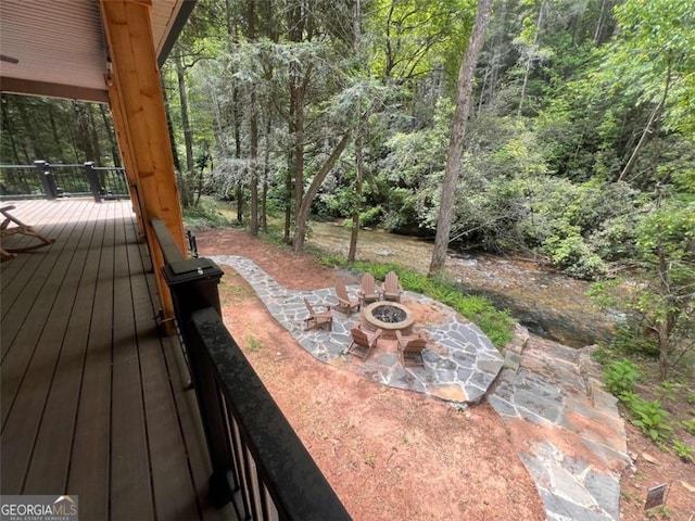 1102 Soque Wilderness Rd, Clarkesville, GA 30523 - wooden deck with a fire pit, a patio area, and a forest view