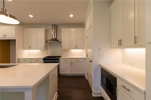 709 Dodd Ln Unit 165, Buford, GA 30518 - kitchen featuring wall chimney range hood, black appliances, backsplash, white cabinetry, and dark wood-style flooring