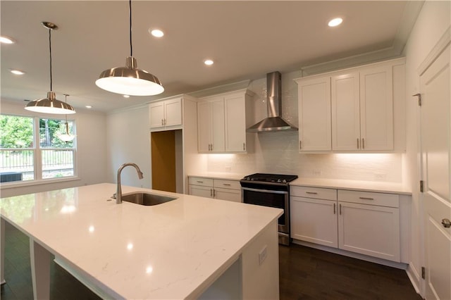 709 Dodd Ln Unit 165, Buford, GA 30518 - kitchen with wall chimney range hood, range with gas cooktop, a sink, tasteful backsplash, and recessed lighting