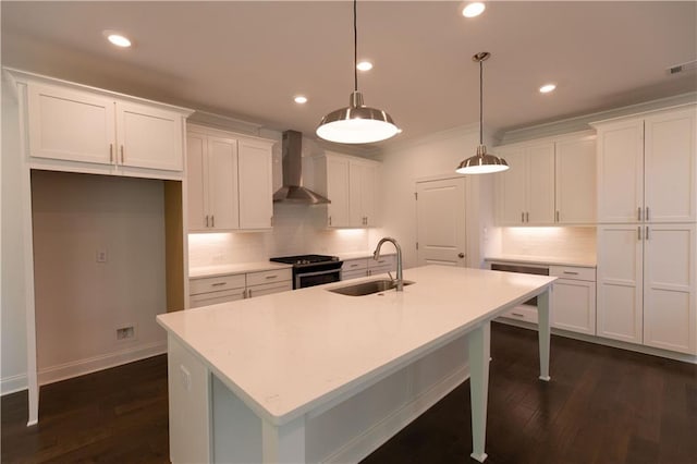 709 Dodd Ln Unit 165, Buford, GA 30518 - kitchen with wall chimney exhaust hood, a sink, range with gas cooktop, decorative backsplash, and an island with sink